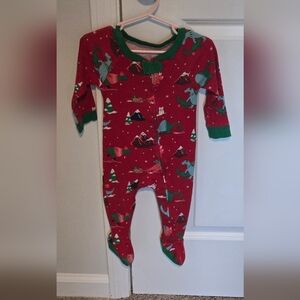 Boys red Dinosaur light one piece footies pajamas.